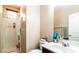 Bathroom featuring a glass door shower stall, toilet and vanity with sink and faucet at 9856 Chief Sky St, Las Vegas, NV 89178
