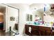 Well-organized bathroom featuring vanity and plenty of counter space and mirror space for your daily routines at 9856 Chief Sky St, Las Vegas, NV 89178