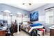 This is a bedroom with striped blue walls, a ceiling fan, and a window with blinds at 9856 Chief Sky St, Las Vegas, NV 89178
