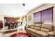 Bright living area open to kitchen with hardwood floors and comfortable seating at 9856 Chief Sky St, Las Vegas, NV 89178