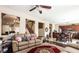 Cozy living room featuring a comfortable sofa, and hardwood floors at 9856 Chief Sky St, Las Vegas, NV 89178