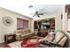 Inviting living room with custom shelving, plush seating, and decorative accents at 9856 Chief Sky St, Las Vegas, NV 89178