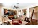 Spacious living area featuring custom shelving, plush seating, and hardwood floors at 9856 Chief Sky St, Las Vegas, NV 89178