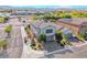 Stunning aerial view of a two-story home showcasing its beautiful surroundings and proximity to community amenities at 10025 San Floriano St, Las Vegas, NV 89178