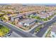 Stunning aerial view of a vibrant neighborhood, highlighting the community's layout, landscaping, and mountain views at 10025 San Floriano St, Las Vegas, NV 89178