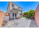 Expansive backyard with a covered patio, BBQ, and verdant landscaping, ideal for outdoor enjoyment at 10025 San Floriano St, Las Vegas, NV 89178