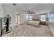 Primary bedroom with neutral carpet and large windows at 10025 San Floriano St, Las Vegas, NV 89178