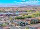 A high angle aerial view of the neighborhood, showcasing neat rows of homes and shared community spaces at 10025 San Floriano St, Las Vegas, NV 89178