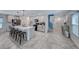 Open concept kitchen with large island, stainless steel appliances, and tile floors at 10025 San Floriano St, Las Vegas, NV 89178