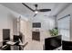 Home office with neutral carpet, ceiling fan and large windows at 10025 San Floriano St, Las Vegas, NV 89178