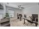 Bright office with neutral carpet, ceiling fan and large windows at 10025 San Floriano St, Las Vegas, NV 89178
