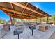 Covered picnic area with multiple tables and grills, perfect for outdoor gatherings and community events at 10025 San Floriano St, Las Vegas, NV 89178