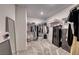 Spacious walk-in closet features ample shelving, hanging racks, and room for storage, plus full length mirror at 10025 San Floriano St, Las Vegas, NV 89178