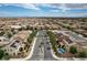 Aerial shot of community, showcasing street, homes, and desert mountain backdrop at 1005 Old Creek Way, North Las Vegas, NV 89084