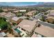 Aerial view of home with pool, patio, lush backyard, and well-kept landscaping at 1005 Old Creek Way, North Las Vegas, NV 89084