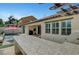 Outdoor oasis boasting a pool, covered patio, and bar area, perfect for relaxation and entertainment at 1005 Old Creek Way, North Las Vegas, NV 89084