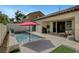 Beautiful backyard showcases a refreshing pool, patio area, and comfortable outdoor seating perfect for lounging at 1005 Old Creek Way, North Las Vegas, NV 89084