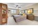 Comfortable bedroom boasts ample natural light, neutral colors, and an open floor plan at 1005 Old Creek Way, North Las Vegas, NV 89084