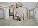 Inviting foyer with tile flooring, elegant staircase, and stylish decor at 1005 Old Creek Way, North Las Vegas, NV 89084