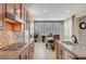 Open kitchen with stainless steel appliances and breakfast area featuring natural light from large windows at 1005 Old Creek Way, North Las Vegas, NV 89084