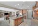 Open-concept kitchen with island, stainless steel appliances, and a view into the living room at 1005 Old Creek Way, North Las Vegas, NV 89084