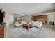 Comfortable living room showcasing two sofas, a coffee table, and seamless transition to the kitchen area at 1005 Old Creek Way, North Las Vegas, NV 89084