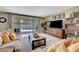 Inviting living room with sliding doors to the pool area, perfect for indoor-outdoor living at 1005 Old Creek Way, North Las Vegas, NV 89084