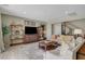 Bright living room featuring modern decor, a large TV, and comfortable seating area at 1005 Old Creek Way, North Las Vegas, NV 89084
