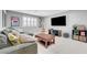 Inviting living room features comfortable seating, entertainment center, and decorative gamer-themed accessories at 1005 Old Creek Way, North Las Vegas, NV 89084