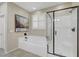 Well-lit main bathroom with a modern shower, a soaking tub, and a sleek design at 1005 Old Creek Way, North Las Vegas, NV 89084