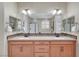 Stylish main bathroom featuring double sinks, ample counter space, and decorative lighting at 1005 Old Creek Way, North Las Vegas, NV 89084
