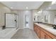 Elegant main bathroom boasting double sinks, a separate shower, and a luxurious bathtub at 1005 Old Creek Way, North Las Vegas, NV 89084
