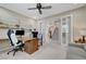 Bright office space with French doors, ceiling fan, and comfortable seating at 1005 Old Creek Way, North Las Vegas, NV 89084