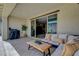 Comfortable patio with outdoor furniture and a grill, ideal for entertaining with a view of the pool at 1005 Old Creek Way, North Las Vegas, NV 89084