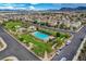 Aerial view of a community featuring a pool, playground, green spaces, and well-maintained homes at 1055 Fish Pond Ave, Henderson, NV 89014