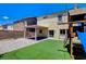 Backyard featuring a play structure and covered patio creating an inviting outdoor living space at 1055 Fish Pond Ave, Henderson, NV 89014