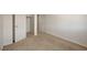 Bright bedroom featuring neutral carpet, a closet, and a door to an adjacent space at 1055 Fish Pond Ave, Henderson, NV 89014
