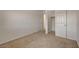 Bedroom with a closet featuring bright white walls and neutral carpet flooring and a closet at 1055 Fish Pond Ave, Henderson, NV 89014