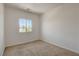 Carpeted bedroom featuring a bright window offering natural light at 1055 Fish Pond Ave, Henderson, NV 89014