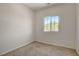 Cozy carpeted bedroom featuring a bright window offering natural light at 1055 Fish Pond Ave, Henderson, NV 89014