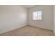 Light and airy carpeted bedroom with a bright window and neutral walls at 1055 Fish Pond Ave, Henderson, NV 89014