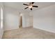 Neutral bedroom with ceiling fan and doorway to another room at 1055 Fish Pond Ave, Henderson, NV 89014