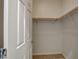 Walk-in closet features carpeted floor and wooden rods at 1055 Fish Pond Ave, Henderson, NV 89014