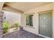 Inviting front porch with stone pillar accents and a brick-paved walkway leading to the front door at 1055 Fish Pond Ave, Henderson, NV 89014