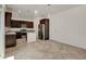 Open concept kitchen features stainless steel appliances and dark cabinetry at 1055 Fish Pond Ave, Henderson, NV 89014