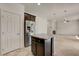 Bright kitchen boasts stainless steel appliances and an island with a granite countertop at 1055 Fish Pond Ave, Henderson, NV 89014