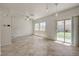 Bright, unfurnished living room with large windows and backyard access at 1055 Fish Pond Ave, Henderson, NV 89014