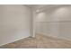 Unfurnished living room featuring neutral walls, tiled floors, and an open floorplan at 1055 Fish Pond Ave, Henderson, NV 89014