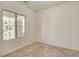 Bright, airy living room with tile flooring and a neutral color palette, ready for personal touches at 1055 Fish Pond Ave, Henderson, NV 89014