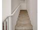 Carpeted staircase with white railing and walls at 1055 Fish Pond Ave, Henderson, NV 89014